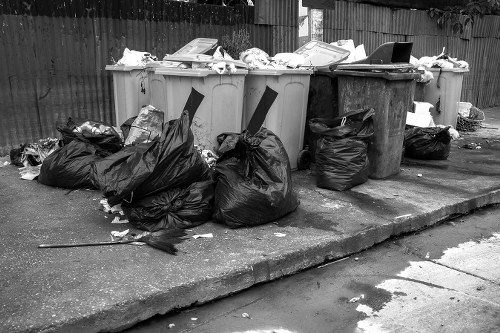 Construction workers managing waste on site in Cricklewood